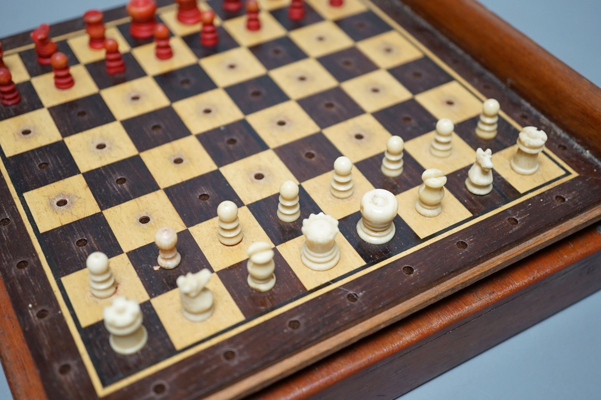 Two boxed chess sets, one turned wood, the other bone